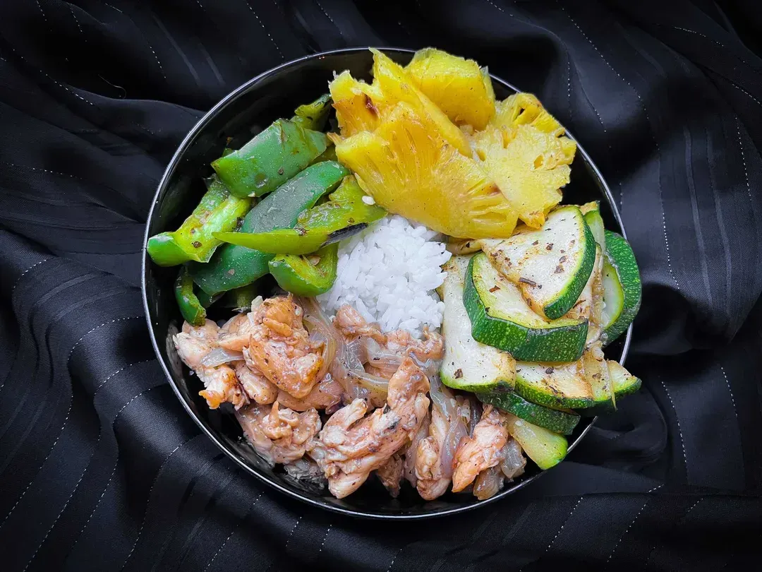 This Hawaiian bowl is made with rice, zucchini, chicken, and of course pineapple.