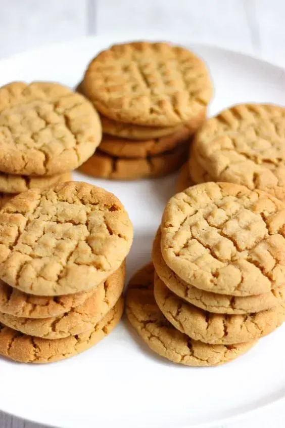 On a white plate, there are five stacks of four delicious-looking cookies!