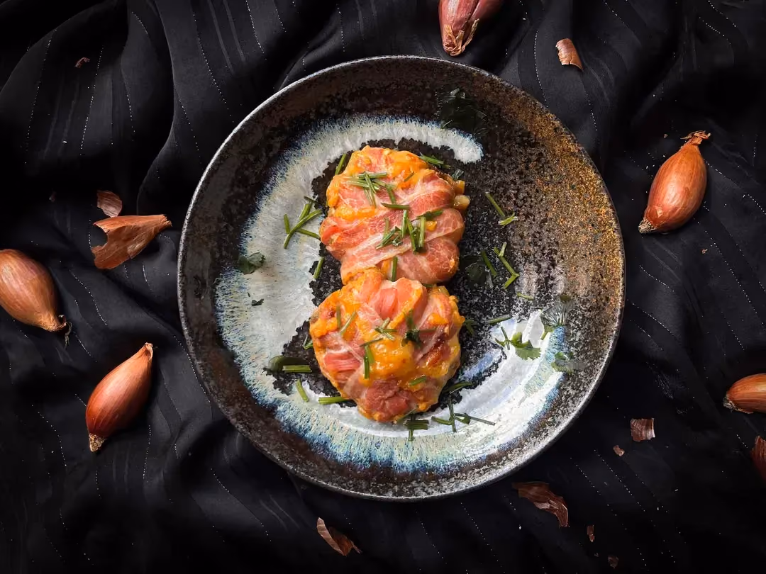 In a small blue bowl is the bacon and sweet potato dome with a surprise center of Camembert and caramelized onions.