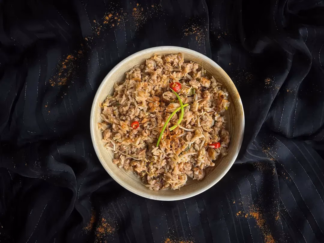 An off-white stoneware dish holds the reinvented kongnamul bap recipe.