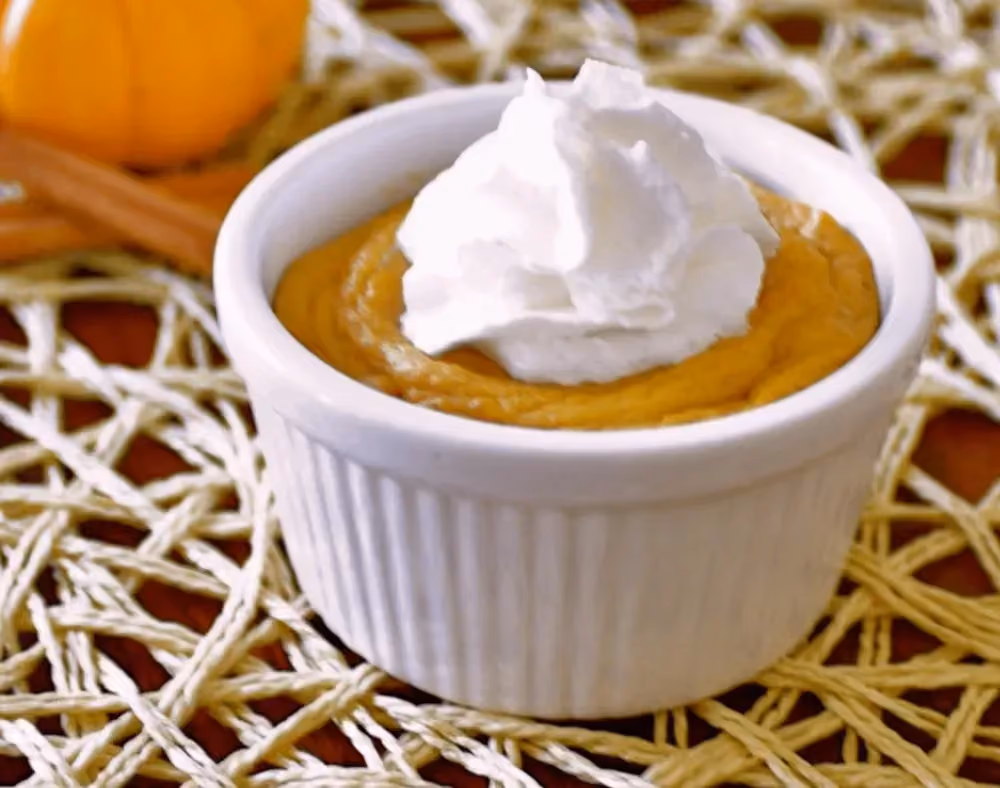 Pumpkin purée is presented in a small white earthenware dish. The topping is made with fromage blanc.
