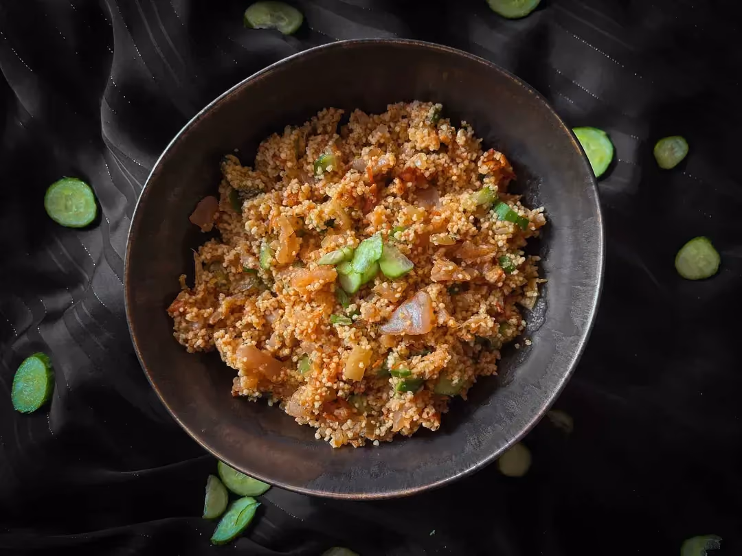 The tabbouleh is made with herring and cucumbers cut into small pieces. Everything is served in a small bowl.
