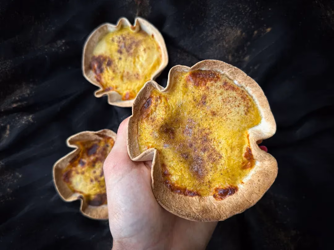 Three mini tortillas hold the pumpkin pie.
