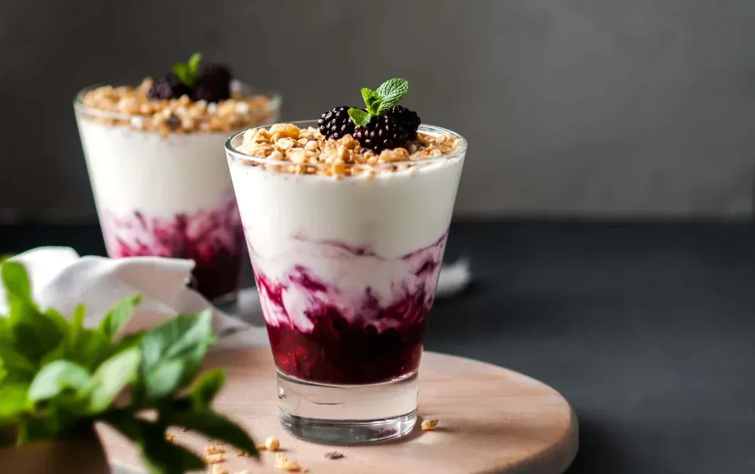 In two glass cups is the Blackberry and Konjac Pearl Parfait. The topping is made up of three plump blackberries.