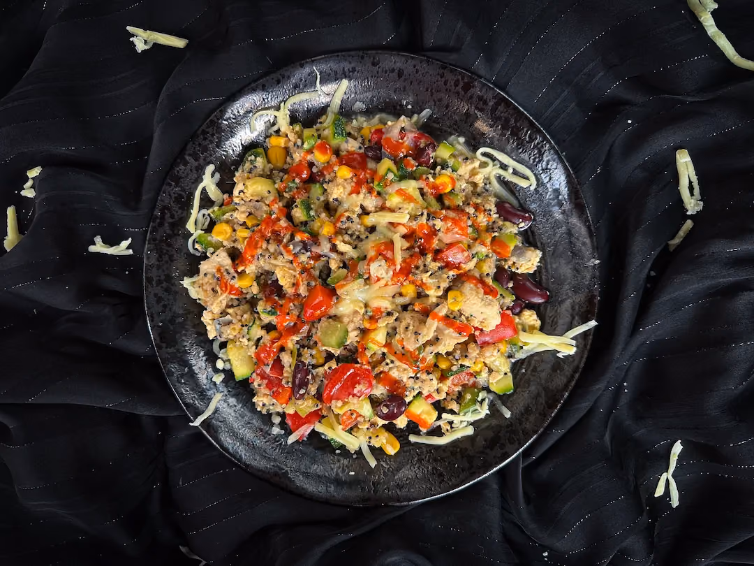 On a black plate, the Mexican skillet dish shows all the ingredients mixed together.
