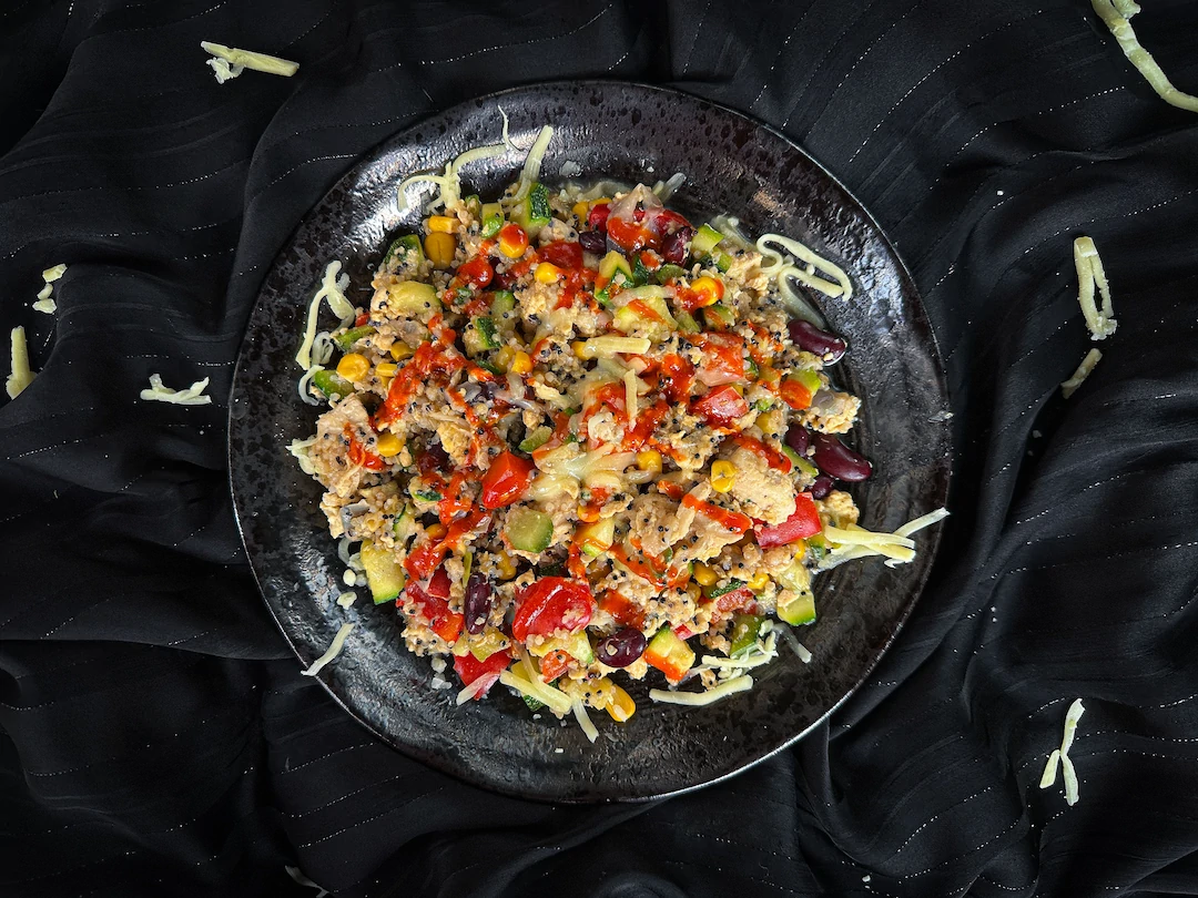 On a black plate, the Mexican skillet dish shows all the ingredients mixed together.