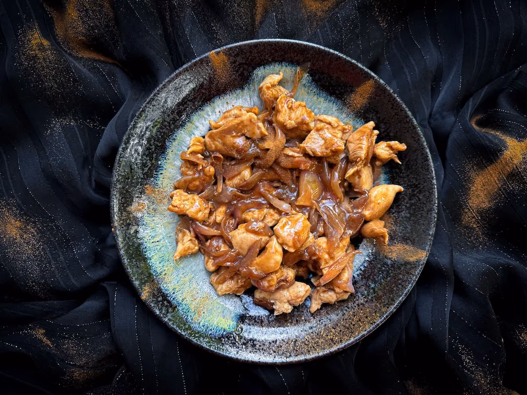 Beautifully browned, the chicken pieces are served with finely chopped chives. It's a feast for the eyes and the taste buds.