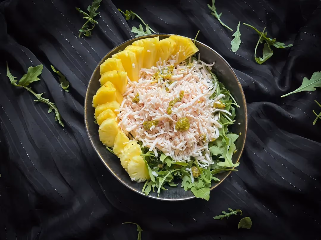 Pineapple salad, arugula, shredded chicken, Greek yogurt and Parmesan dressing.