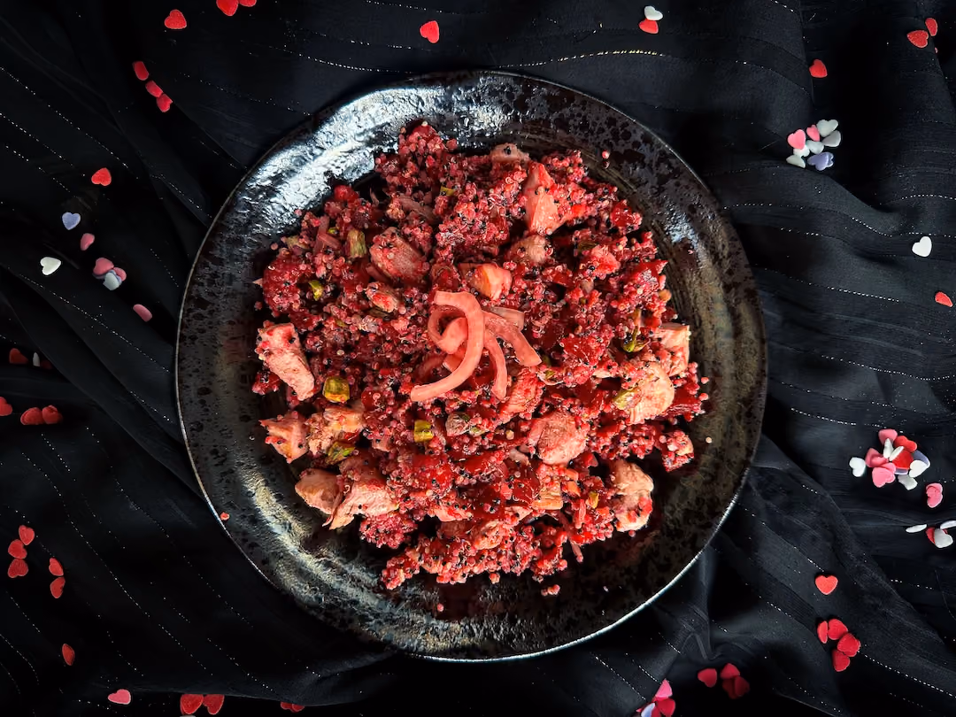 The beets have beautifully colored all the ingredients in the quinoa, beet, raspberry, pistachio, and chicken salad recipe.