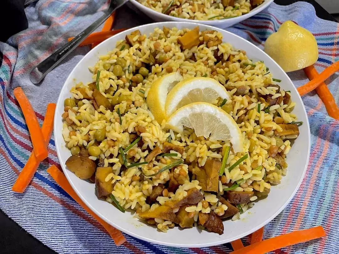Served in a shallow dish, this exotic salad looks irresistible. Three lemon slices complete the presentation.