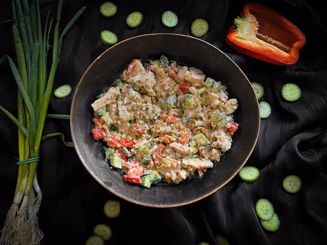 The Mediterranean-style salad is made with lentils, chicken strips, fromage blanc, feta, cucumber, and red bell pepper.