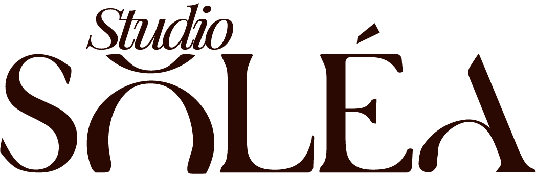 Studio Soléa logo with stylized dark burgundy text and accent marks.