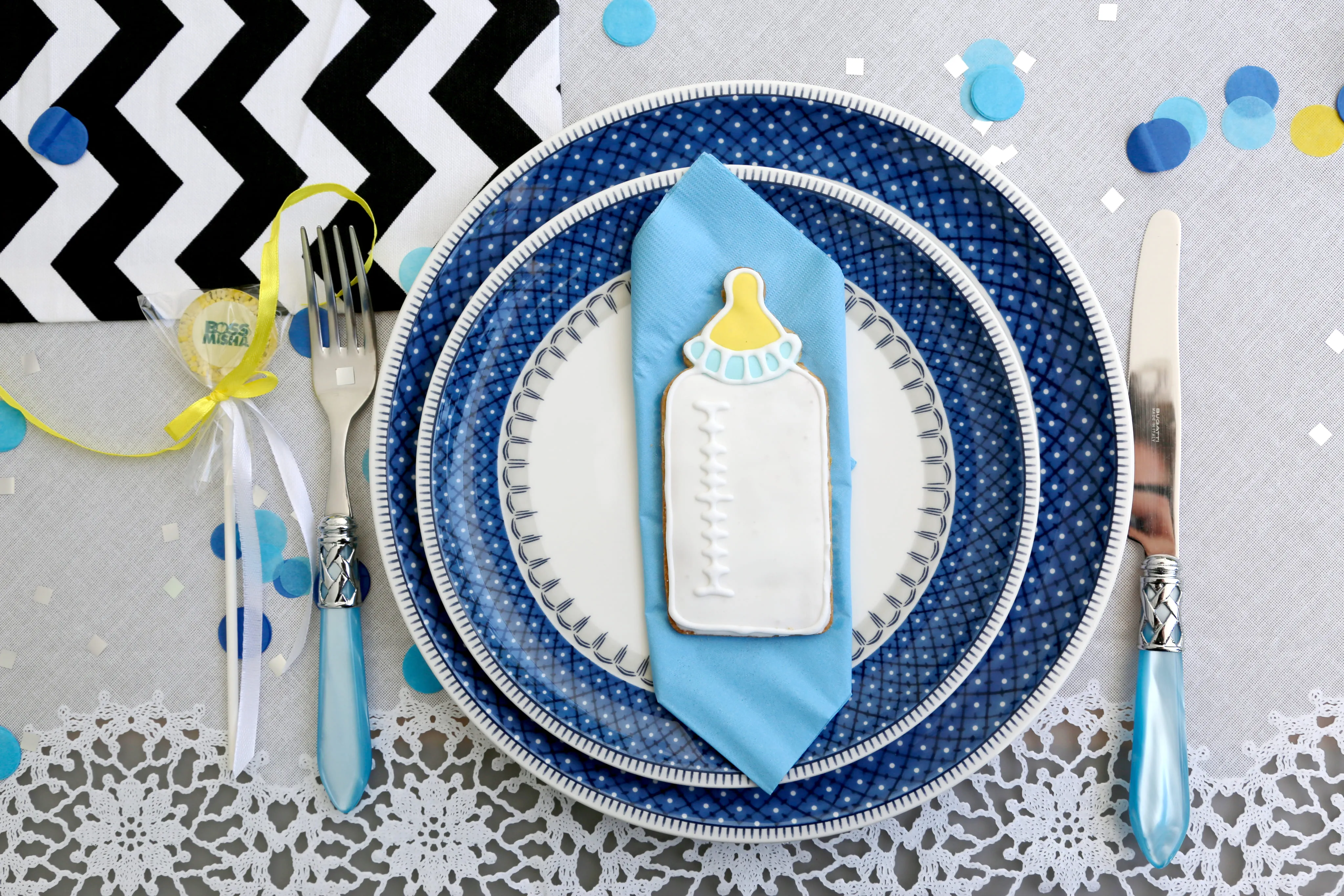 Baby bottle cookie place setting styled on elegant tableware for a baby shower in Limassol Cyprus