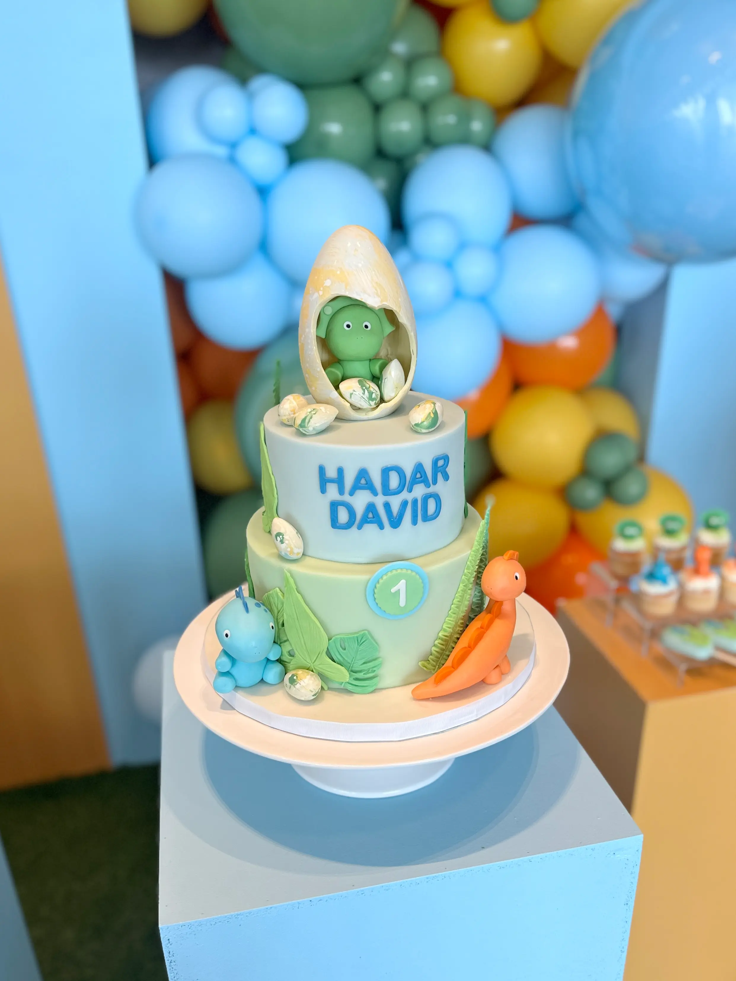 Baby boy first birthday cake with dinosaur theme, personalised cake with name hadar david, pastel blue and green designer cake in cyprus
