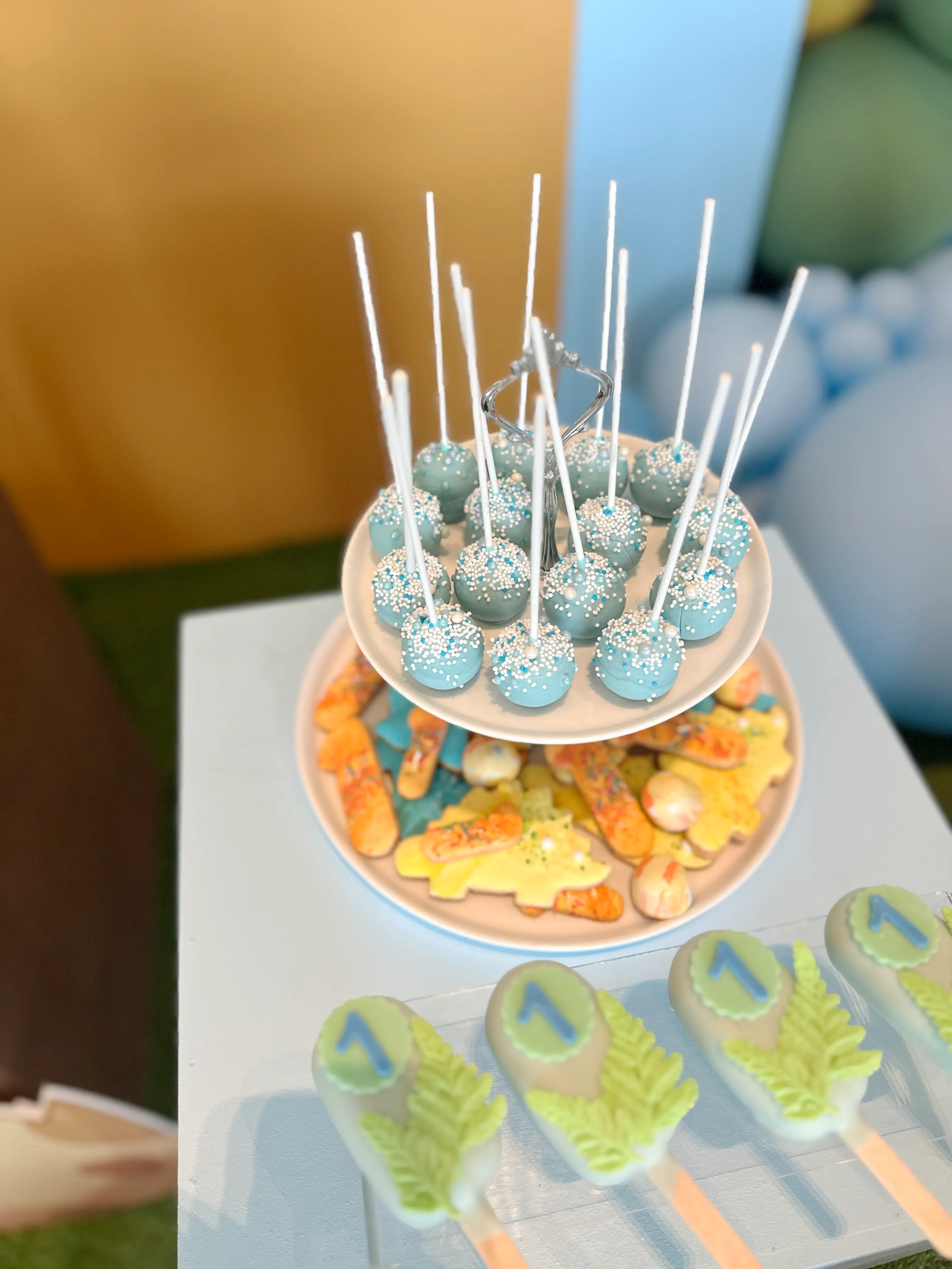 Blue cake pops with white sprinkles and themed decorated cookies, coordinated dessert table treats for events in limassol cyprus