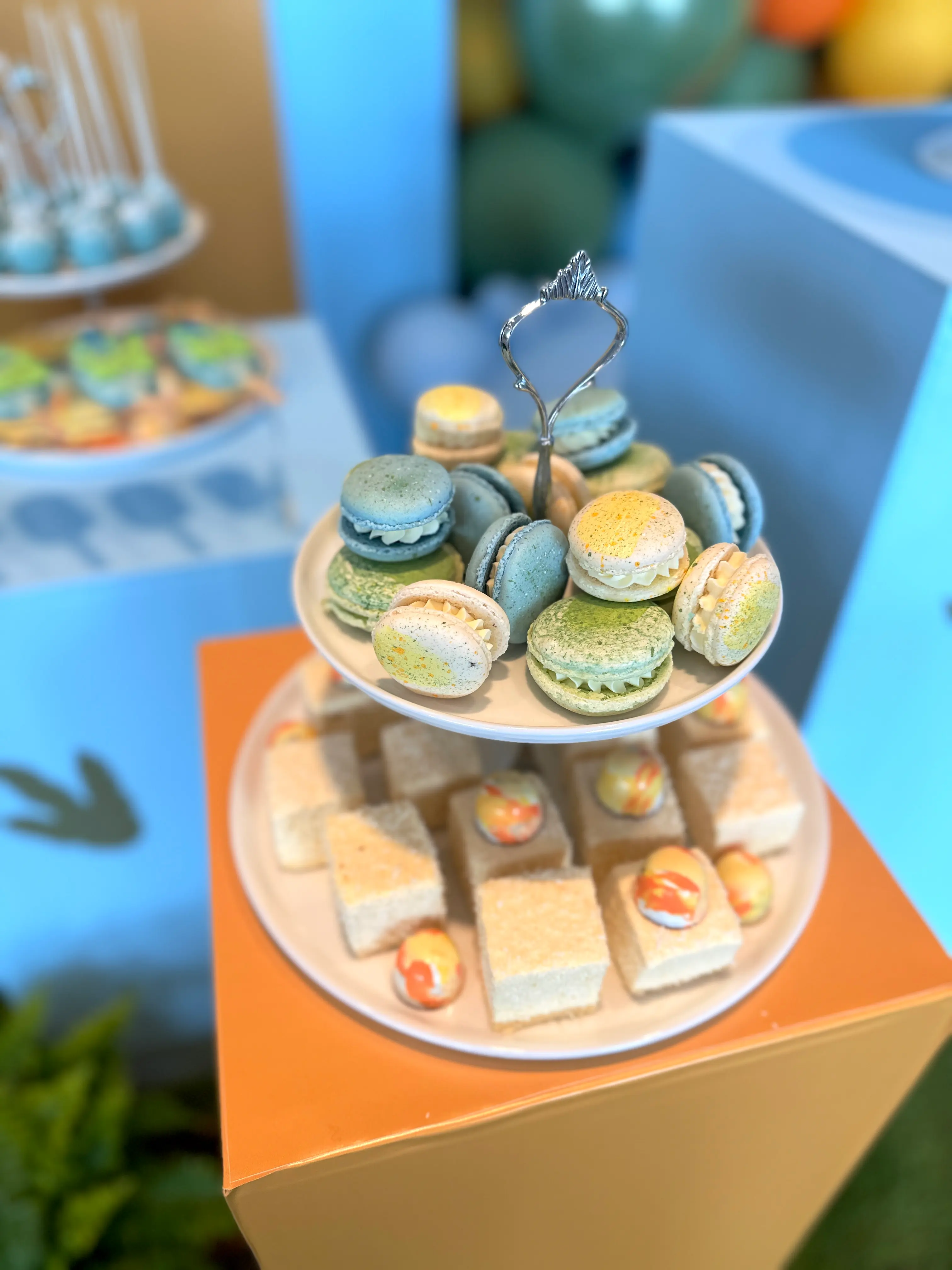 Assorted macarons displayed on tiered stand, elegant dessert table catering in limassol cyprus