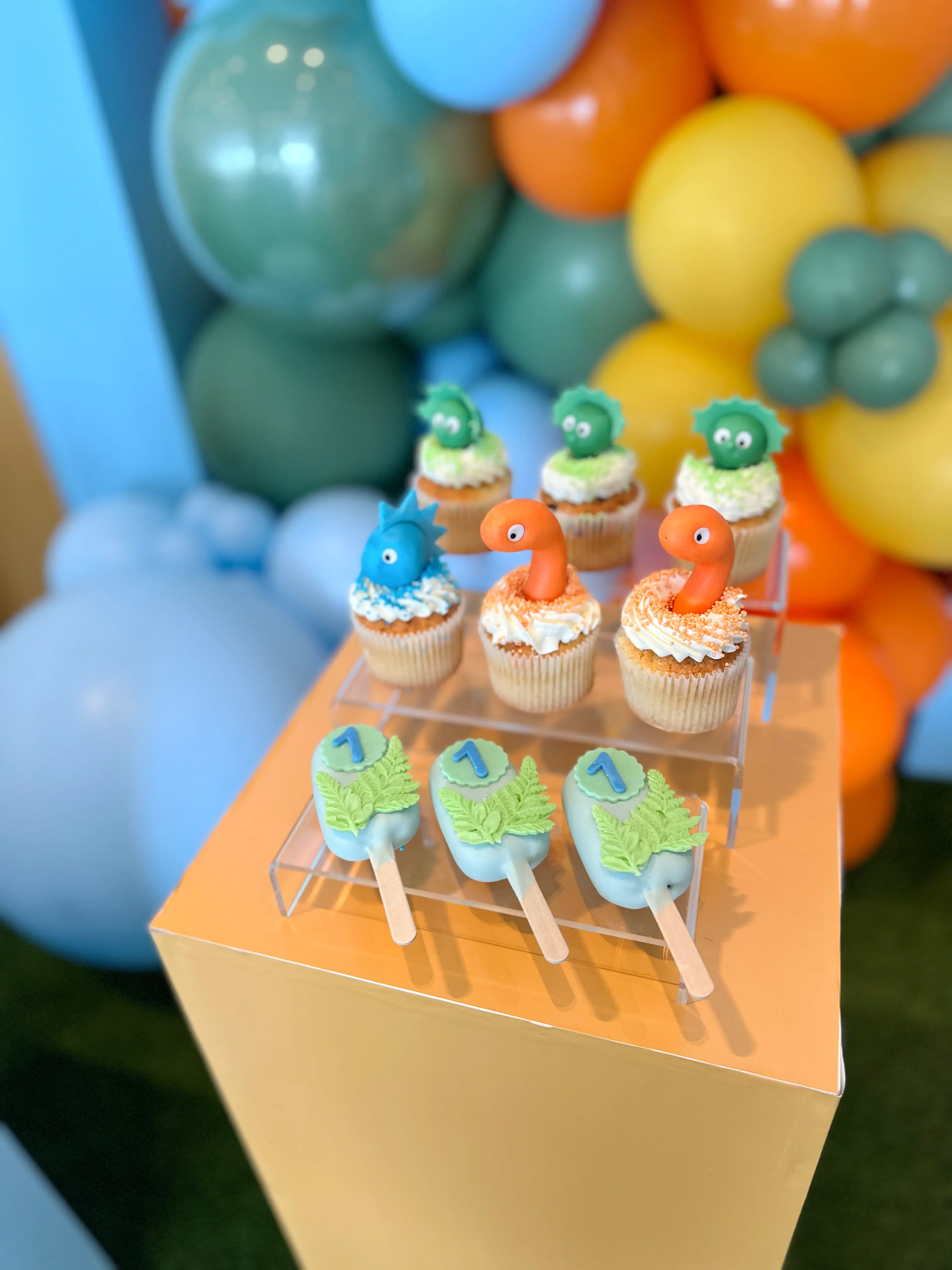 Themed dinosaur cupcakes and decorated cakesicles with custom number detail, fun children’s party desserts in limassol cyprus