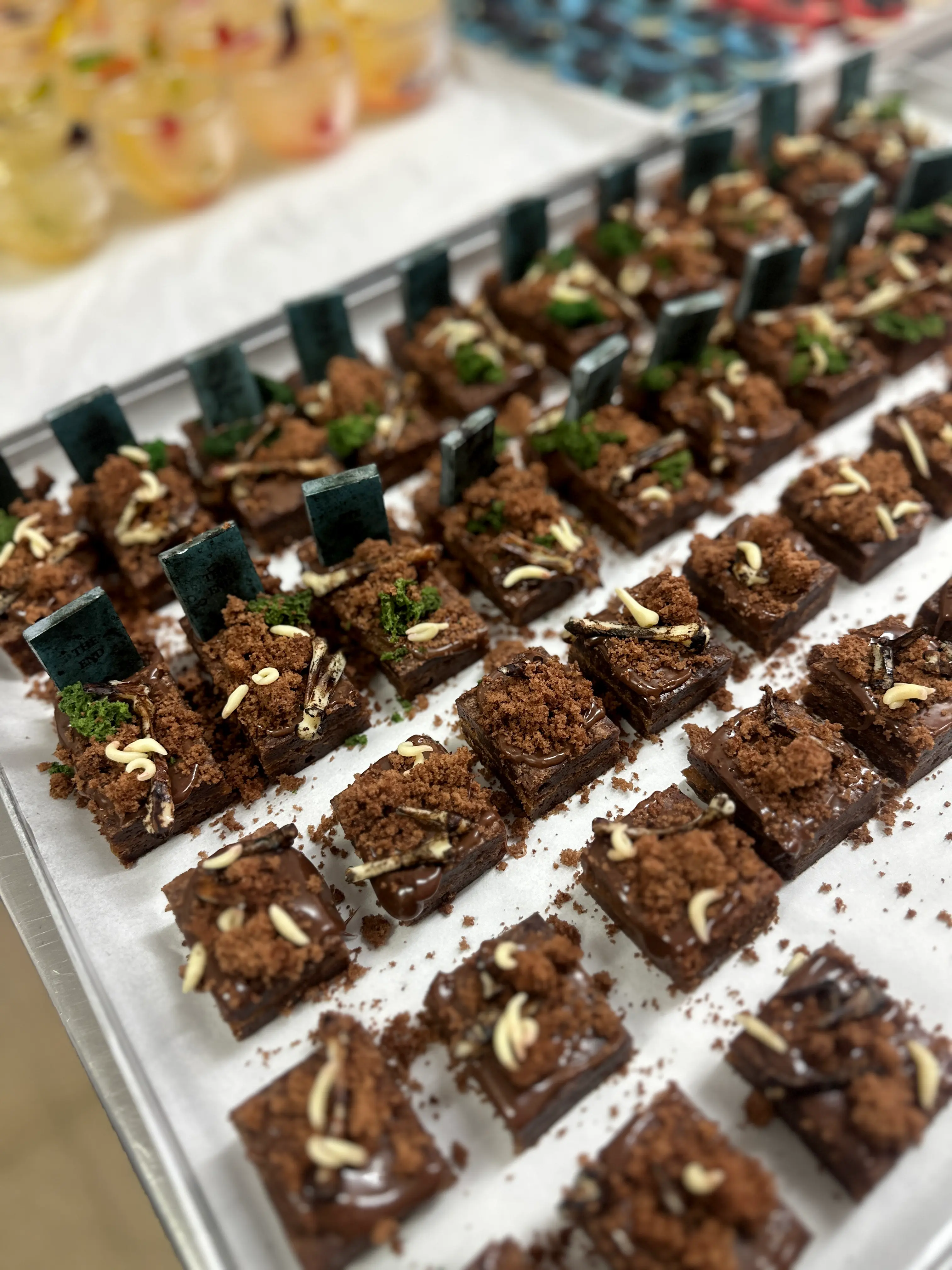 Gourmet chocolate brownie for Halloween topped with crumble, nuts and chocolate drizzle, luxury dessert catering in limassol cyprus