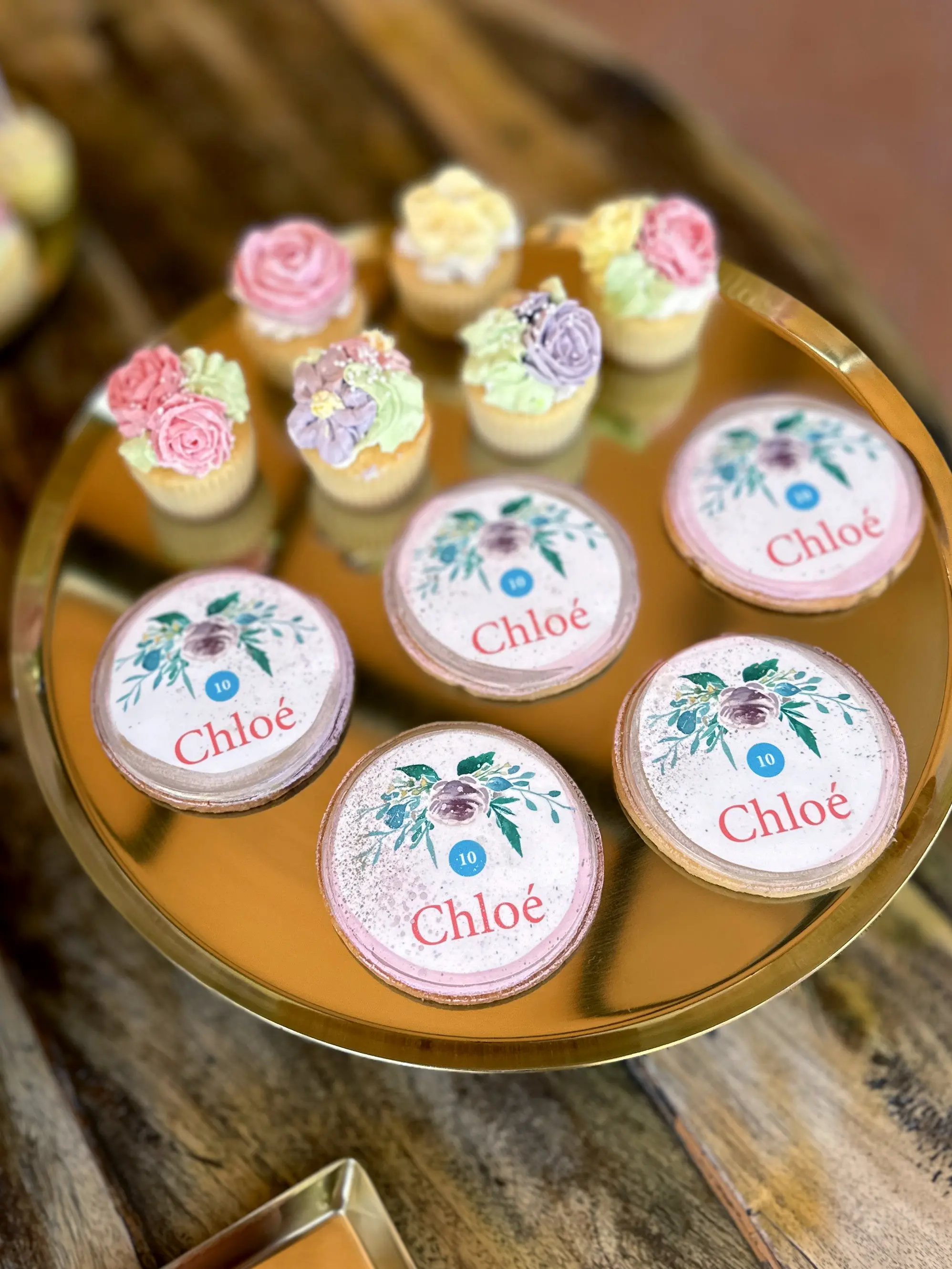 personalised macarons and mini cupcakes with floral buttercream and custom name design, bespoke birthday desserts in limassol cyprus