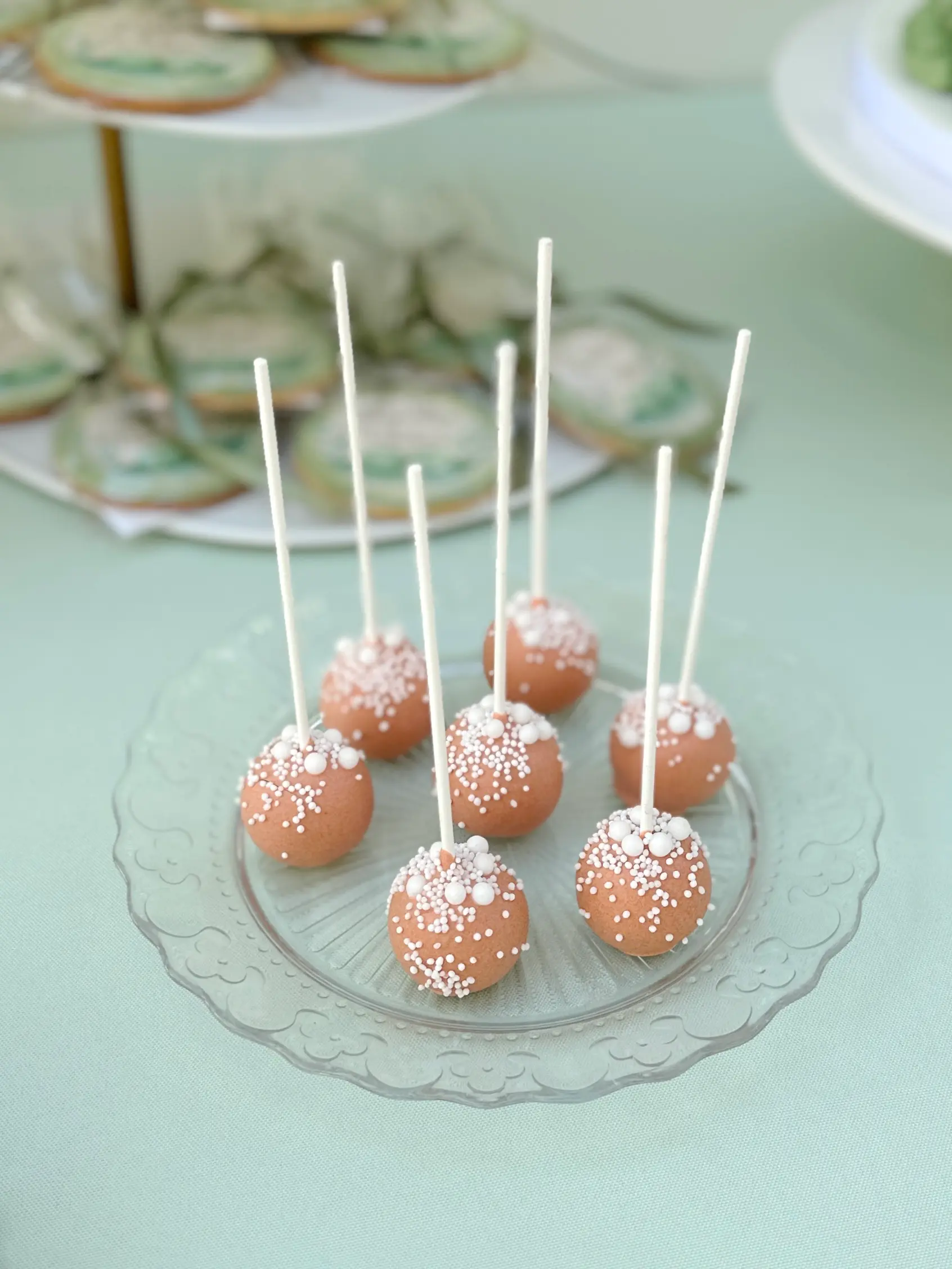 Chocolate cake pops with white chocolate coating and pearl sprinkles, stylish party desserts for celebrations in limassol cyprus