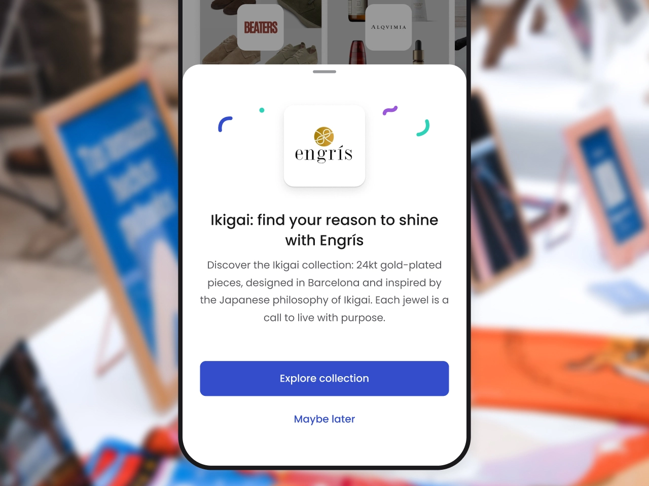 Mobile screen with Engrís jewelry ad promoting Ikigai 24kt gold-plated collection inspired by Japanese philosophy, with buttons to explore collection or choose maybe later.