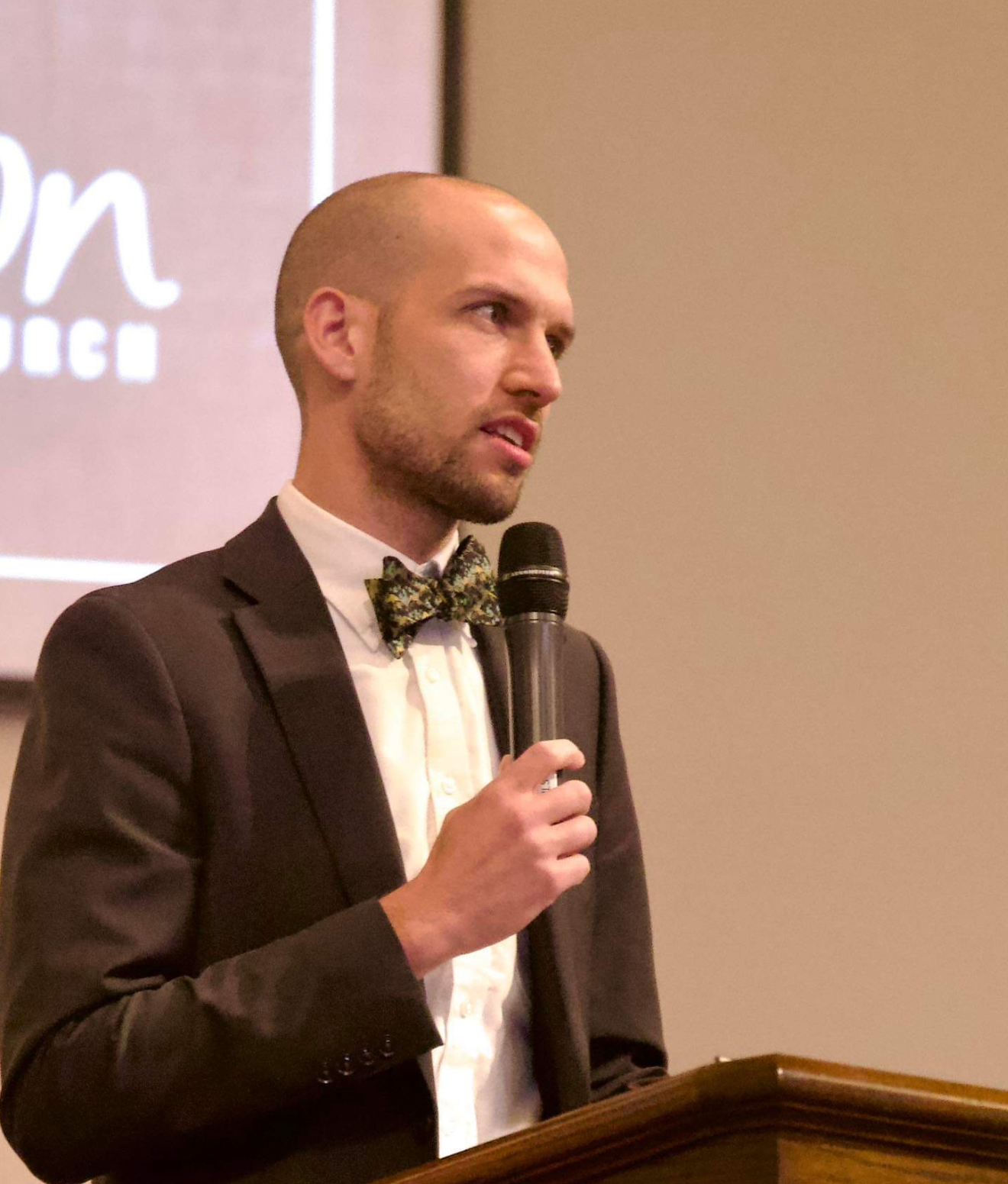 Travis McNeely preaching expository sermon at church