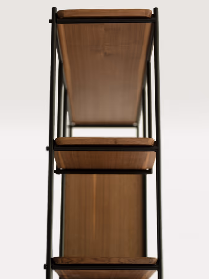 Detail of the Lucca shelving unit in American walnut veneer with solid walnut edges and a clear polyurethane lacquer, mounted on a metal frame