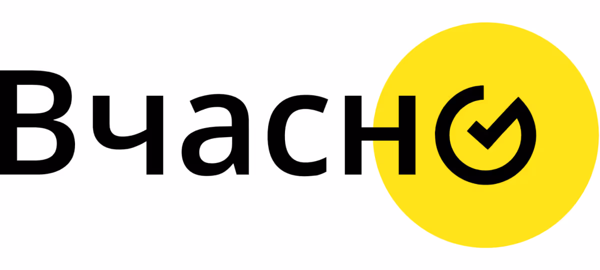 Vchasno logo featuring black Cyrillic text with a yellow circle containing a checkmark symbol.