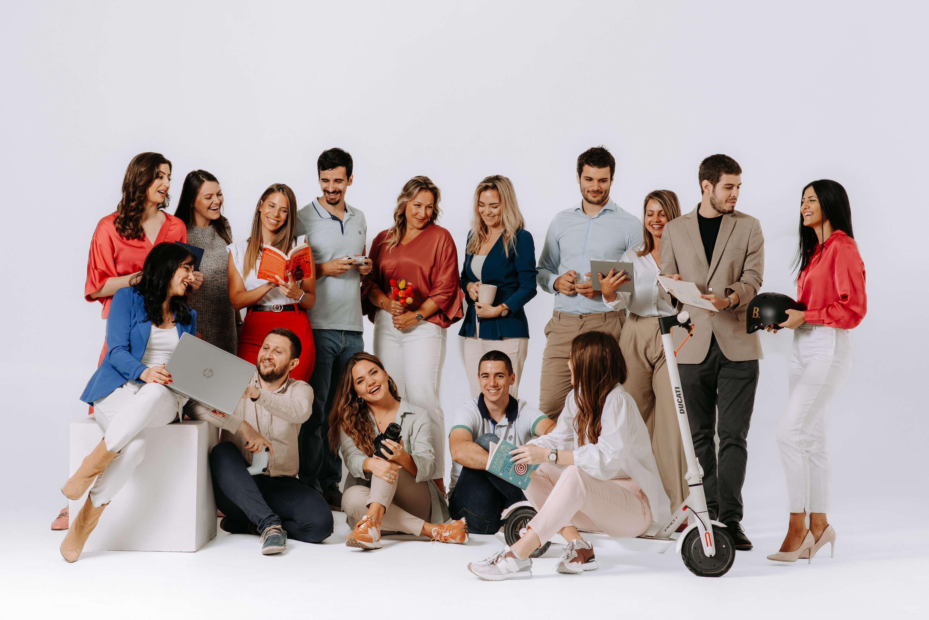 Matcha being poured in a cup, with the bamboo whisk next to it and the matcha package in the back