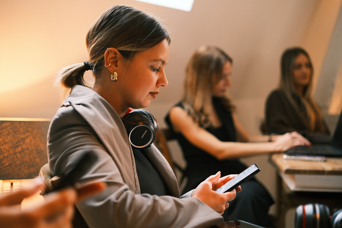 Mixing matcha with bamboo whisk, next to organic matcha package
