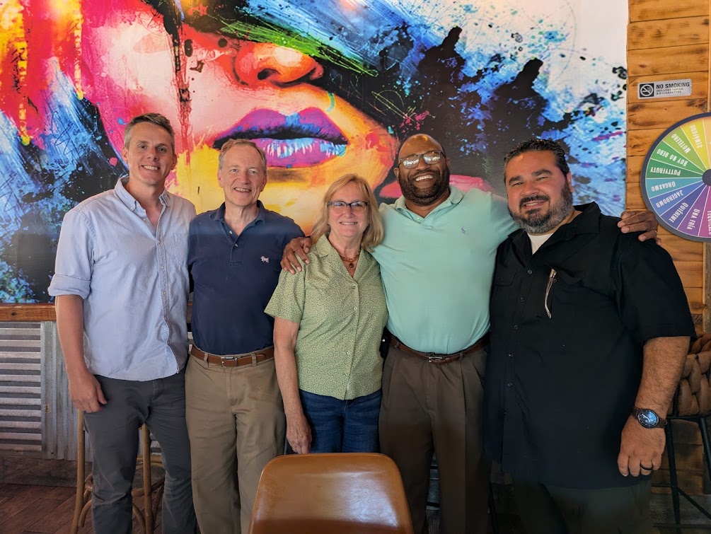 MassIPL Leadership team pose for a photo in a restaurant in Lawrence, MA.