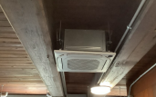 Low-profile wall-mounted mini-split head