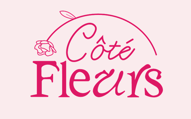 Cote in a cursive font and fleurs underneath it with a pretty serif font. Framing the top of the words is a half circle flower, looks like a carnation flower 
