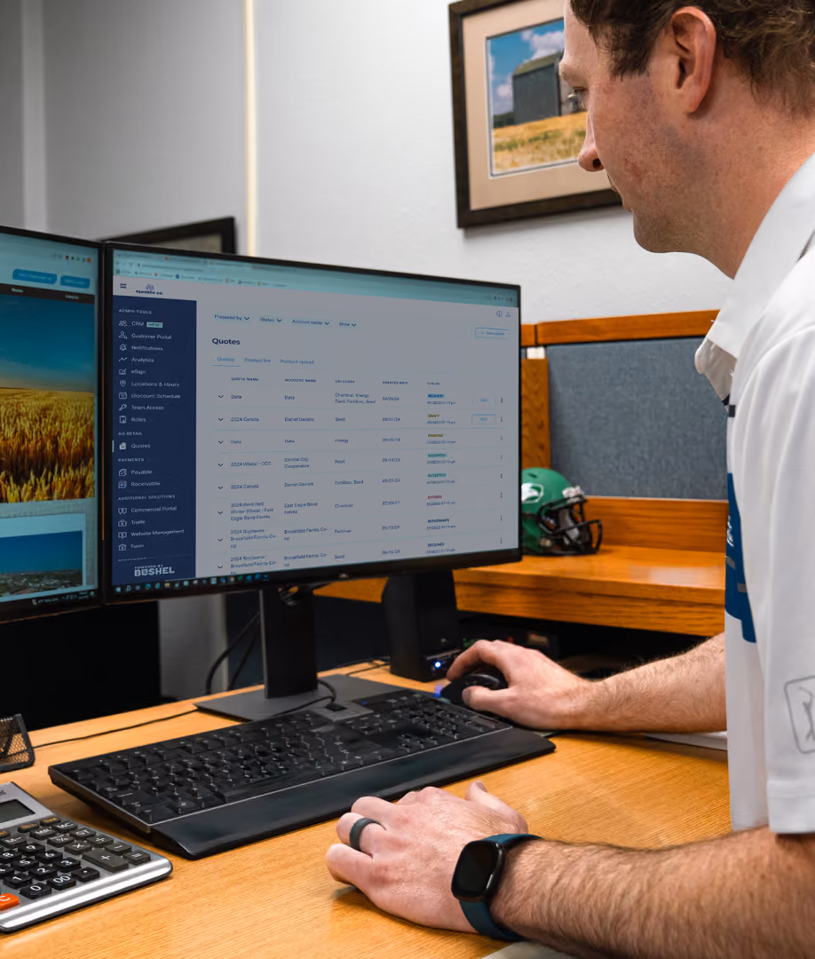 Bushel professional services team member working at a dual-monitor workstation