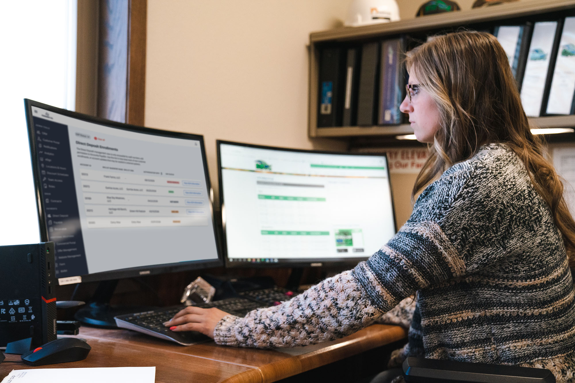 Staff member looking at two monitors