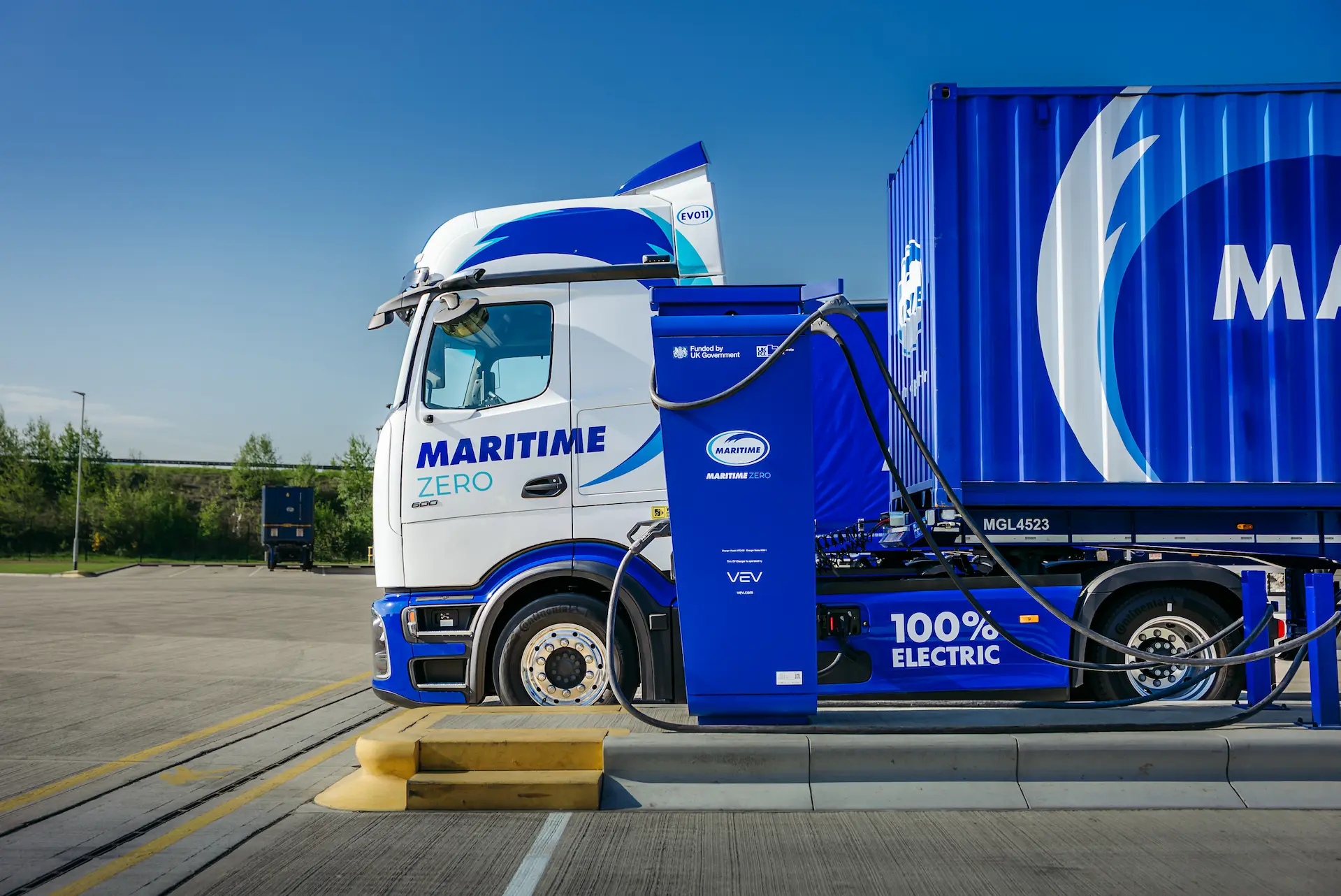 Maritime ZERO eHGV parked next to an eHGV charger.