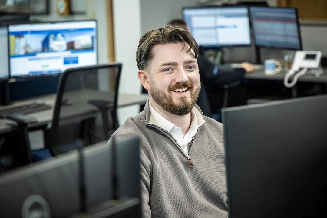 Office worker smiling.