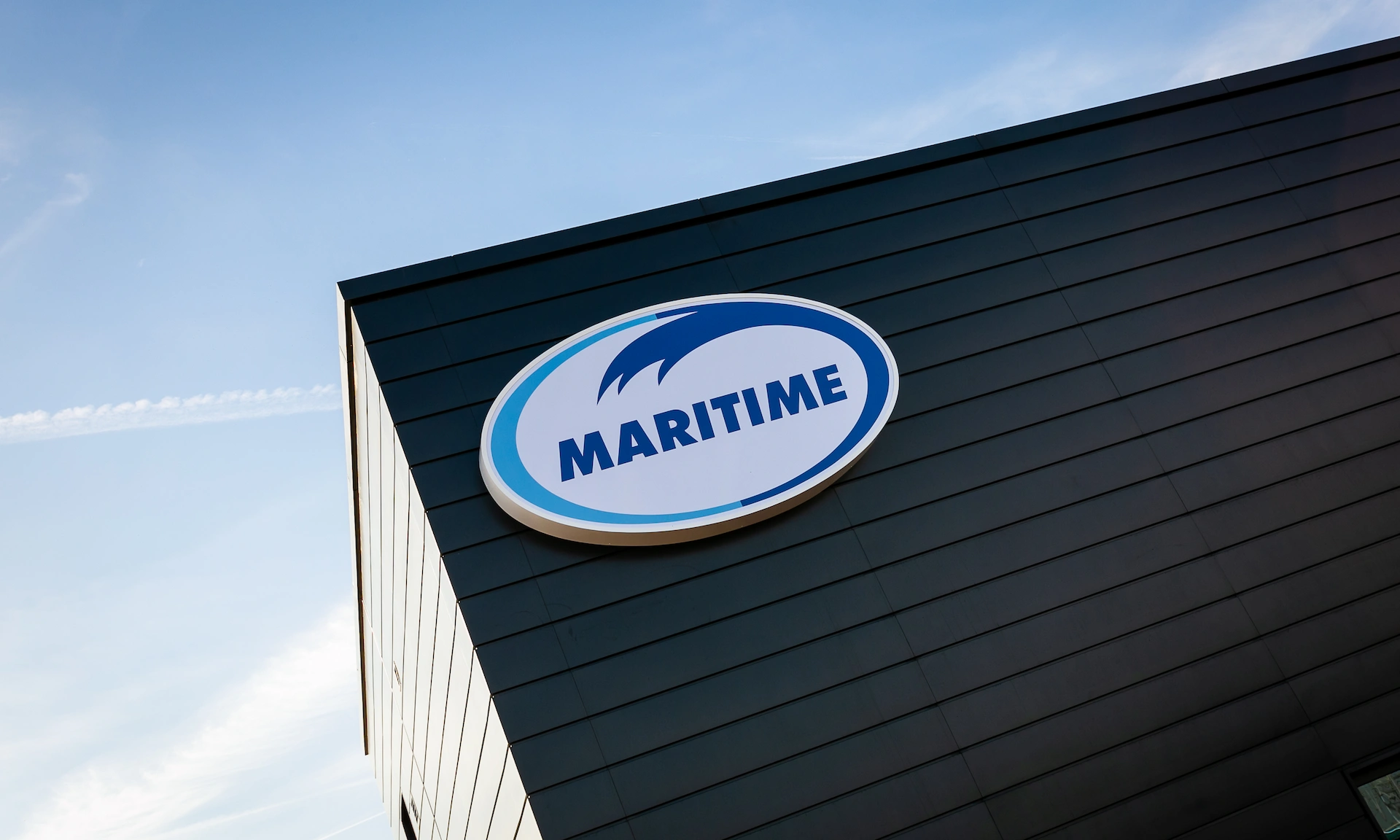 A Maritime Transport building against a clear sky.