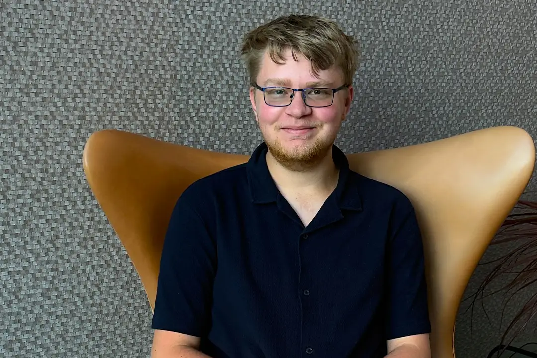 Developer employee sits on chair.