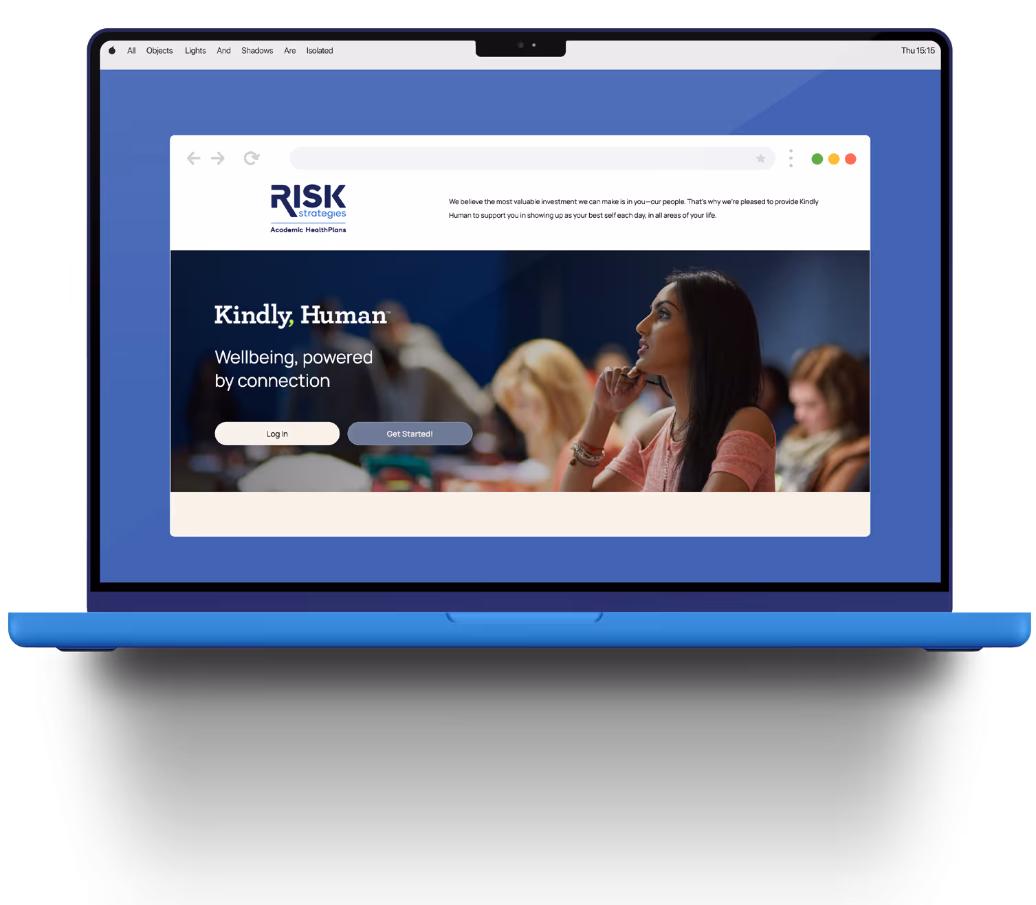 Blue laptop displaying a webpage with the heading Kindly, Human and a photo of a thoughtful woman in a classroom setting.