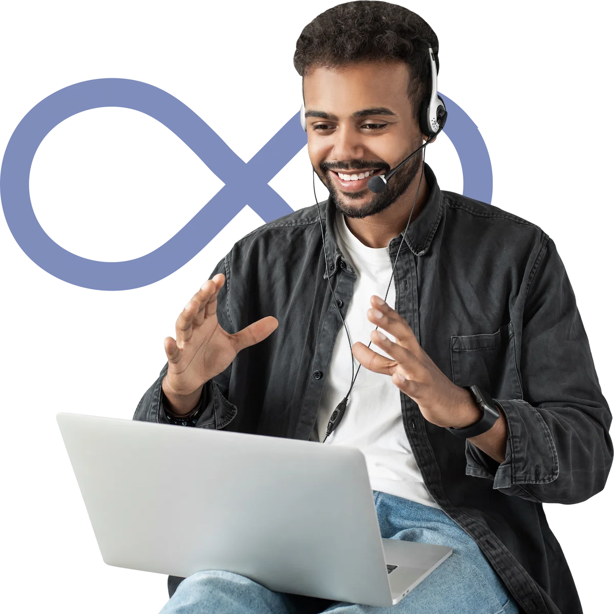 Smiling man with headset gesturing while looking at a laptop during a video call.