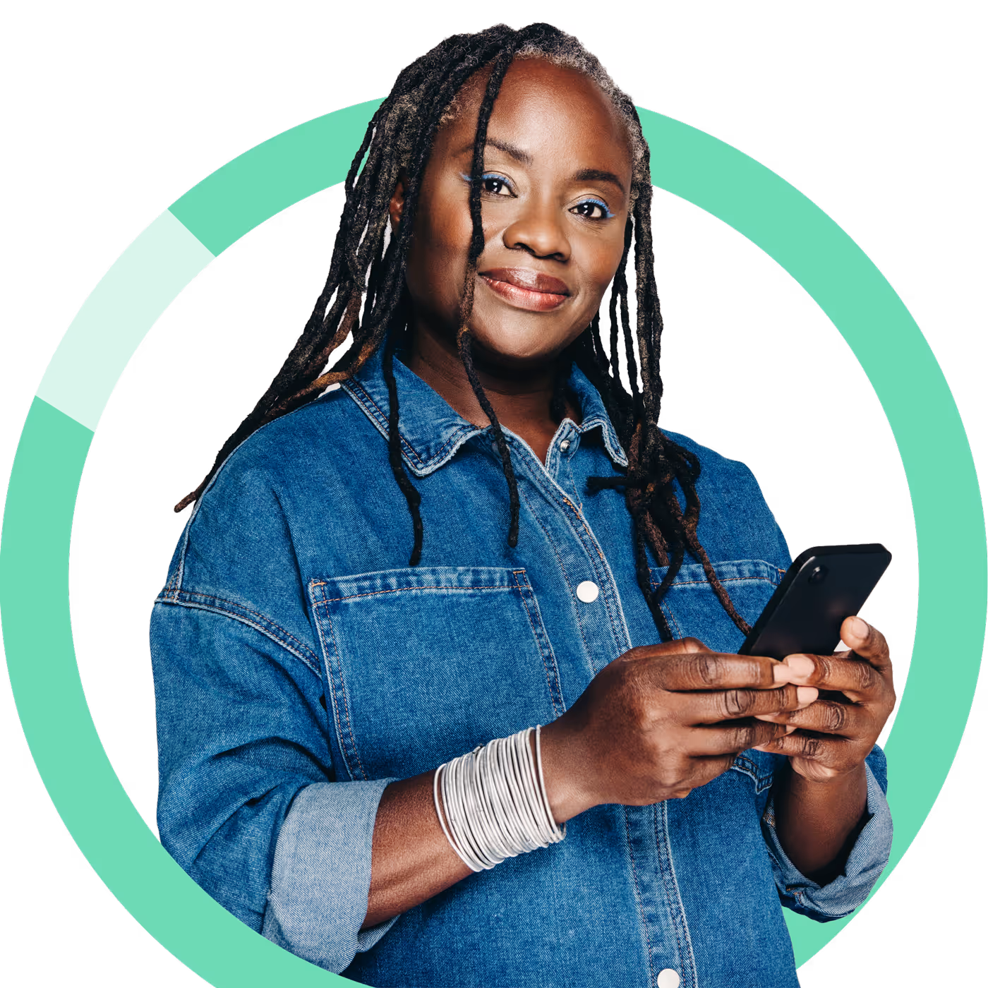 Smiling woman in denim shirt holding a smartphone with a green circular background.