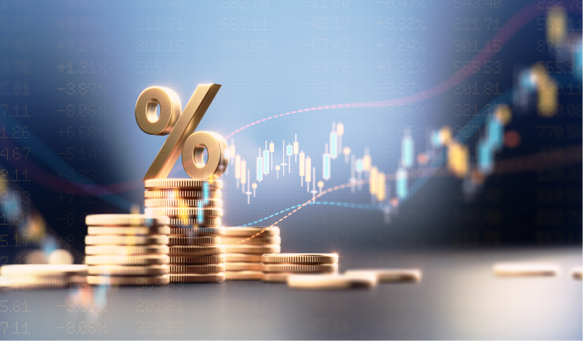 Stacks of gold coins with a gold percentage symbol and a rising stock market graph in the background.