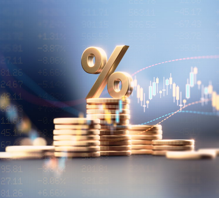 Stacked gold coins with a large gold percentage symbol on top and stock market candlestick chart in background.