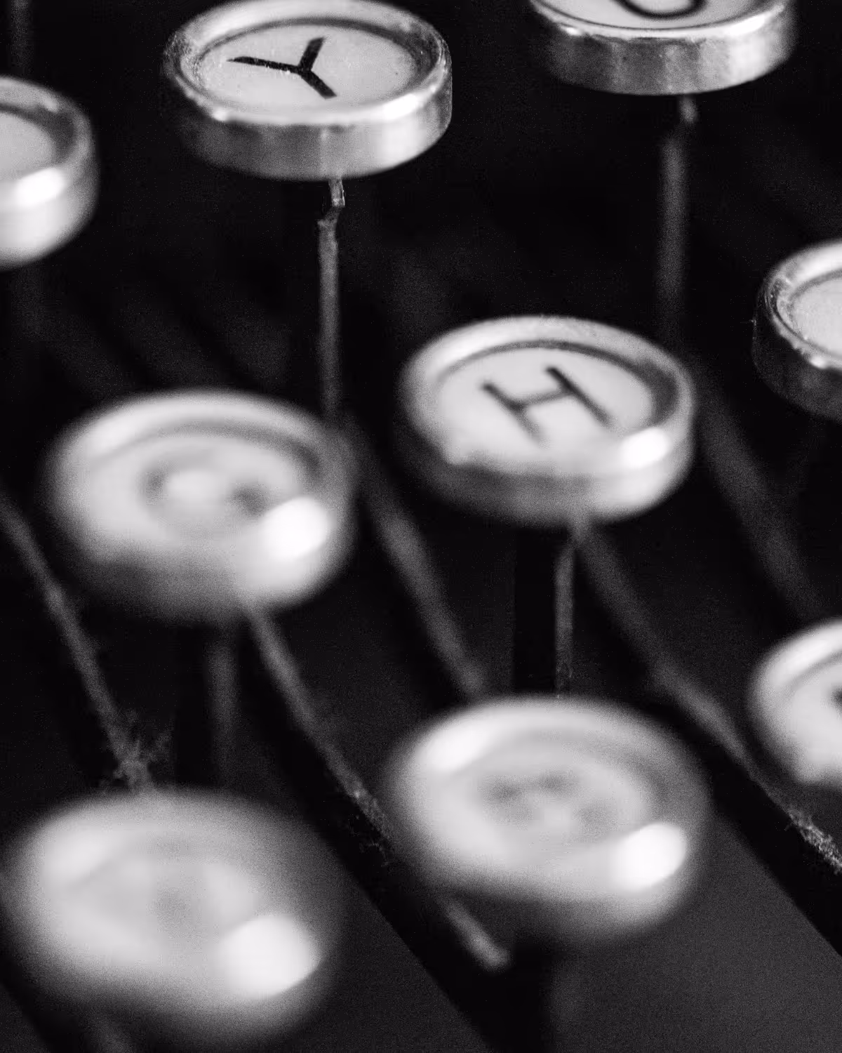 Black and white old-style typewriter keys.