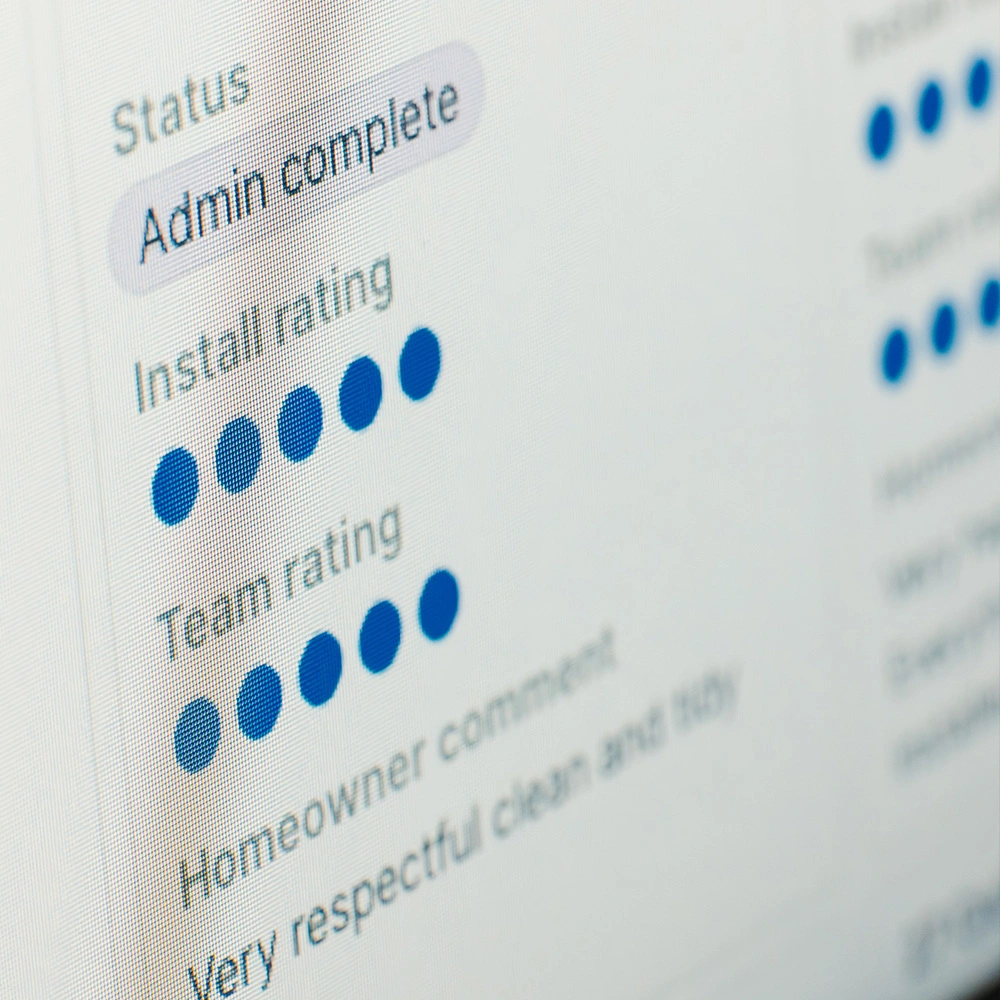 Screen showing status as Admin complete, with install and team ratings of four and five blue dots, plus a homeowner comment praising respectfulness and tidiness.