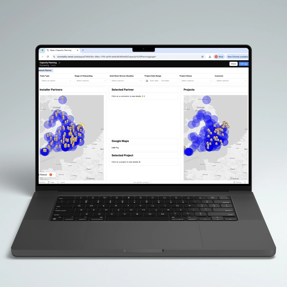 Laptop screen displaying a web-based capacity planning dashboard with maps of the United Kingdom showing installer partners and project locations marked with icons.