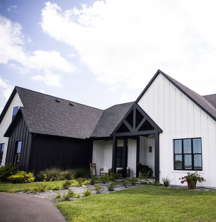 Modern custom home exterior with black and white design built by Tampa Bay home builder