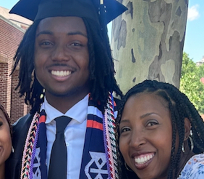 A young man celebrating his graduation with his mother.