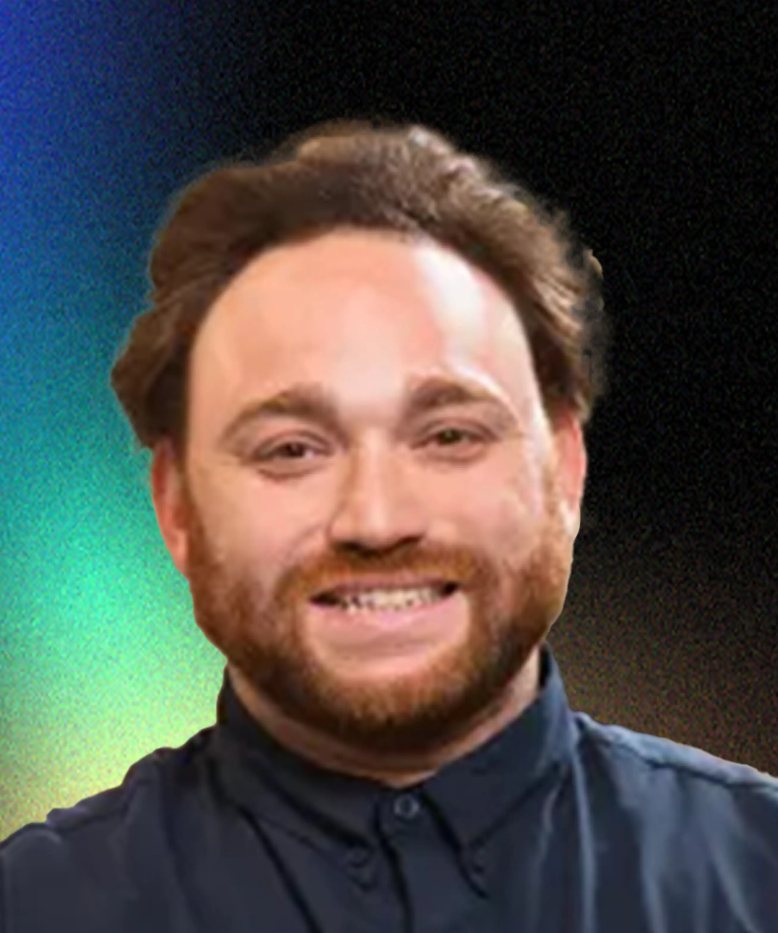 Smiling man with a beard and brown hair wearing a dark button-up shirt against a gradient background.